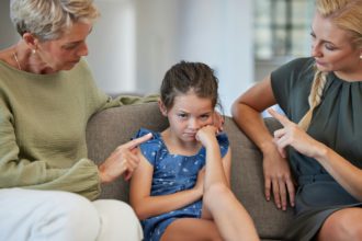 Angry family, discipline and sad children at home for naughty, stubborn and bad behavior problem. M