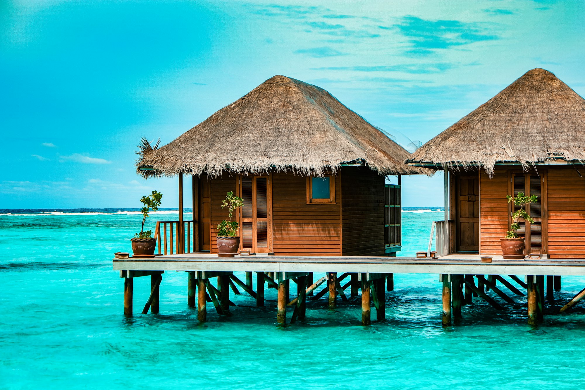 Maldives tropical Island, beautiful isolated luxury water bungalows Maldives in the blue green ocean